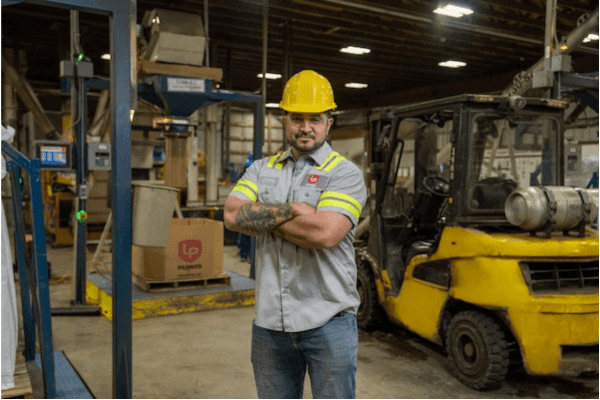 PADNOS Grand Rapids coach, Chris, standing in PADNOS location